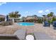 Inviting pool area with lounge chairs and patio furniture at 3756 E Lake Dr, Land O Lakes, FL 34639