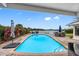 Inviting pool with a large patio and lake view at 3756 E Lake Dr, Land O Lakes, FL 34639