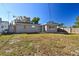 Large backyard with grassy area and privacy fence at 4233 Oakfield Ave, Holiday, FL 34691