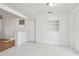 Bright entryway with tiled floor, built-in shelving, and interior door at 4233 Oakfield Ave, Holiday, FL 34691