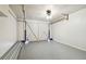 Garage with white door and speckled floor at 4233 Oakfield Ave, Holiday, FL 34691