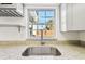 Kitchen with granite countertop and stainless steel sink at 4233 Oakfield Ave, Holiday, FL 34691