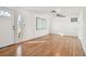 Spacious living room with wood-look flooring and lots of natural light at 4233 Oakfield Ave, Holiday, FL 34691