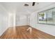 Light-filled living room featuring hardwood floors and a window at 4233 Oakfield Ave, Holiday, FL 34691