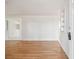 Bright living room with hardwood floors and built-in shelving at 4233 Oakfield Ave, Holiday, FL 34691