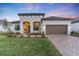 Beautiful one-story home with a two-car garage and landscaped yard at 5225 Caserta Ct, Palmetto, FL 34221