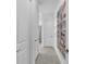 Clean and bright hallway with tile flooring and art at 5225 Caserta Ct, Palmetto, FL 34221