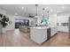 Modern kitchen with large island, stainless steel appliances, and white cabinets at 5225 Caserta Ct, Palmetto, FL 34221
