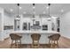 Modern kitchen with a large island and white cabinetry at 5225 Caserta Ct, Palmetto, FL 34221