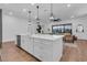 Modern kitchen with white cabinets, quartz countertops, and stainless steel appliances at 5225 Caserta Ct, Palmetto, FL 34221