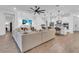 Open living room with hardwood floors, neutral decor, and kitchen views at 5225 Caserta Ct, Palmetto, FL 34221