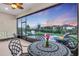 Relaxing screened patio with seating area and fire pit at 5225 Caserta Ct, Palmetto, FL 34221