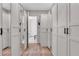 Large walk-in closet with ample built-in shelving and mirrored doors at 5225 Caserta Ct, Palmetto, FL 34221