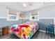 Bright bedroom with beach-themed bedding at 5401 Circle Dr, Weeki Wachee, FL 34607