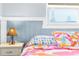 Bedroom with flip-flop bedding and window at 5401 Circle Dr, Weeki Wachee, FL 34607
