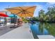 Relaxing dockside patio with seating and umbrella at 5401 Circle Dr, Weeki Wachee, FL 34607