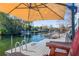 Waterfront dock with umbrella and seating at 5401 Circle Dr, Weeki Wachee, FL 34607