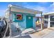 Beach-themed exterior shed with fun decor at 5401 Circle Dr, Weeki Wachee, FL 34607