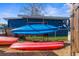 Two kayaks and paddles are stored on a rack outside a home at 5401 Circle Dr, Weeki Wachee, FL 34607