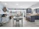 Modern kitchen with gray cabinets and granite countertops at 5401 Circle Dr, Weeki Wachee, FL 34607
