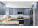 Modern kitchen with stainless steel appliances and island at 5401 Circle Dr, Weeki Wachee, FL 34607