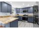 Modern kitchen with stainless steel appliances and granite countertops at 5401 Circle Dr, Weeki Wachee, FL 34607
