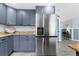 Modern kitchen with stainless steel refrigerator at 5401 Circle Dr, Weeki Wachee, FL 34607
