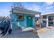 Cute teal shed with flip-flops and skeleton decor on the waterfront at 5401 Circle Dr, Weeki Wachee, FL 34607