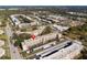 An aerial view of the condo building and its surroundings at 5705 80Th St N # 304, St Petersburg, FL 33709