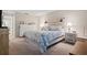 Spacious bedroom with king-size bed and nightstands at 5705 80Th St N # 304, St Petersburg, FL 33709