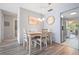 Bright dining area with light wood table and chairs at 5705 80Th St N # 304, St Petersburg, FL 33709