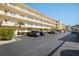 Condo building with parking area in front at 5705 80Th St N # 304, St Petersburg, FL 33709