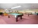 Community game room with billiard tables and shuffleboard at 5705 80Th St N # 304, St Petersburg, FL 33709