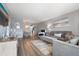 Living room with gray couches and wood-look floors at 5705 80Th St N # 304, St Petersburg, FL 33709