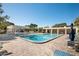 Inviting community pool area with lounge chairs and patio at 5705 80Th St N # 304, St Petersburg, FL 33709