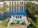 Community pool with surrounding patio and lounge chairs at 5705 80Th St N # 304, St Petersburg, FL 33709
