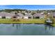 Aerial of houses and lake, highlighting community at 5725 Stockport St, Riverview, FL 33578