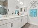 Double vanity bathroom with modern white cabinets at 5725 Stockport St, Riverview, FL 33578