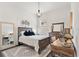Bright bedroom with wood furniture and cozy bedding at 5725 Stockport St, Riverview, FL 33578