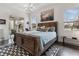 Serene bedroom with a wooden bed, access to patio, and water views at 5725 Stockport St, Riverview, FL 33578