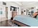 Spacious bedroom with ensuite bathroom and large TV at 5725 Stockport St, Riverview, FL 33578