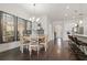 Elegant dining room with a round table, wooden chairs, and large mirrors at 5725 Stockport St, Riverview, FL 33578