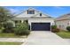 Single-story house with a two-car garage and landscaped front yard at 5725 Stockport St, Riverview, FL 33578