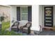 Inviting front porch with rocking chairs and elegant decor at 5725 Stockport St, Riverview, FL 33578