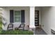 Relaxing front porch with rocking chairs, perfect for enjoying your morning coffee at 5725 Stockport St, Riverview, FL 33578