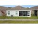 Home features a screened patio and well-manicured lawn at 5725 Stockport St, Riverview, FL 33578