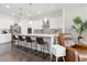 Bright kitchen with an island, seating, and leather armchairs at 5725 Stockport St, Riverview, FL 33578
