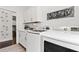 Bright laundry room with white cabinets and shelving at 5725 Stockport St, Riverview, FL 33578