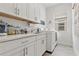 Laundry room with washer, dryer, and white cabinets at 5725 Stockport St, Riverview, FL 33578