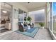 Relaxing screened porch with wicker chairs and a view of the backyard at 5725 Stockport St, Riverview, FL 33578